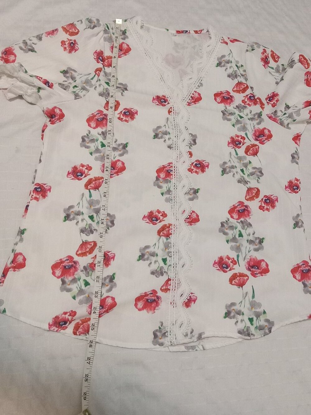 Women's summer tunic with short sleeves and a V-neck with lace trim